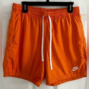 Nike light coral/ peach/ melon lined swim trunks